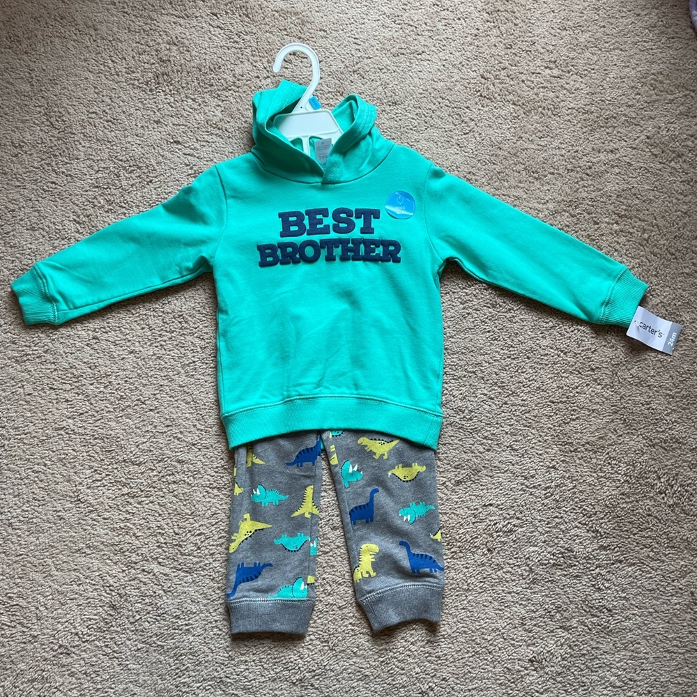 New with tags. Adorable Carters dinosaur hoodie and pants. Boy, 24 months